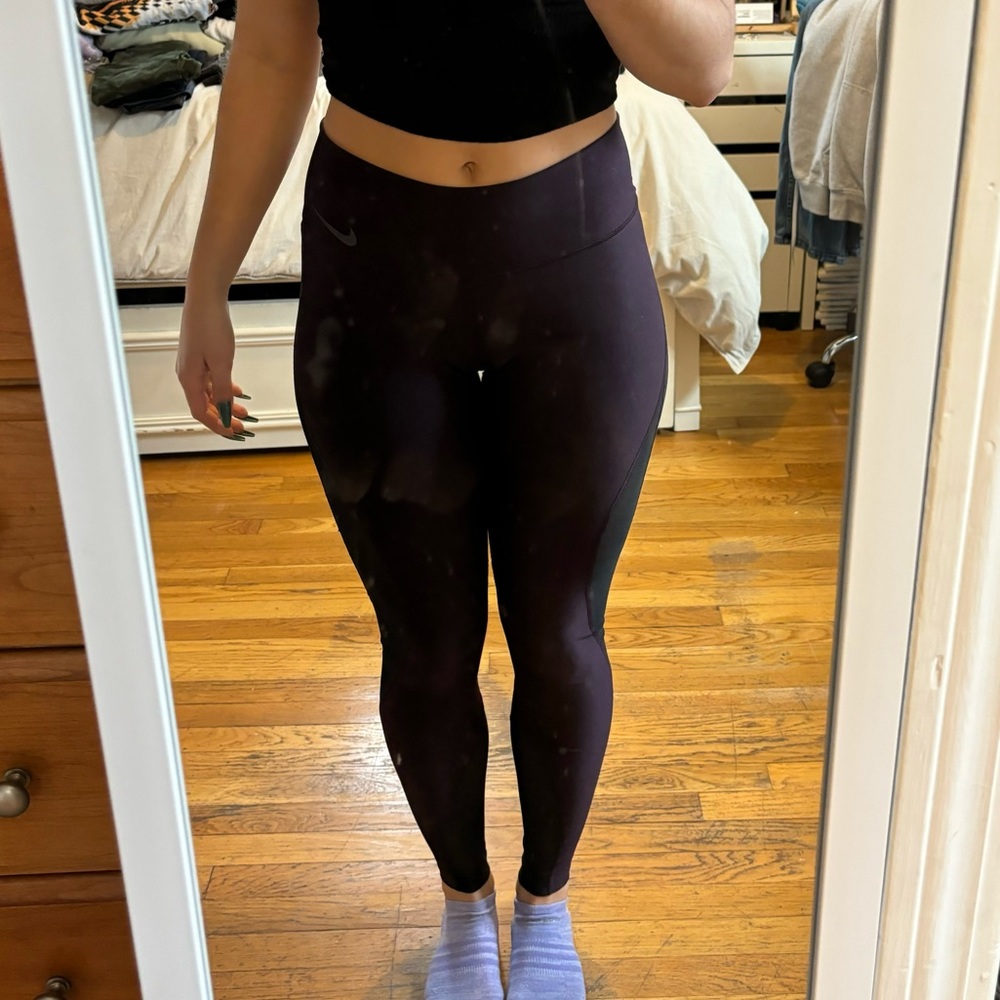 Maroon Nike leggings with mesh cutouts
